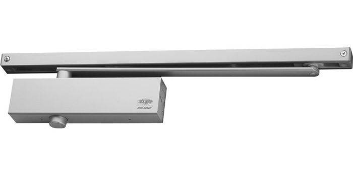 724 SERIES SIZE 2-4 CLOSER ADJUSTABLE BACKCHECK door closer in silver finish with a sleek rectangular design, ideal for controlled door closing in commercial and residential spaces.